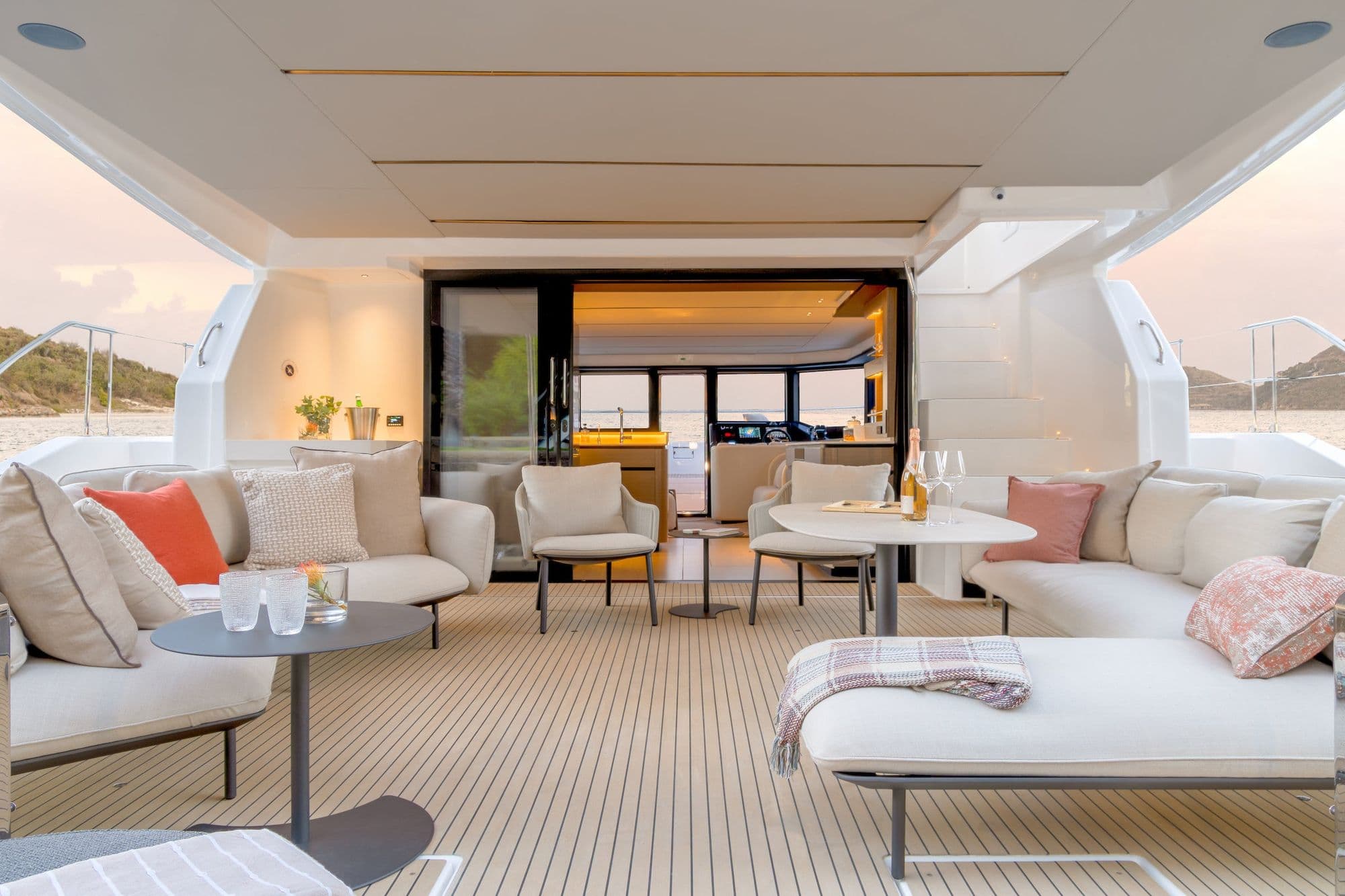 Aft cockpit of the Leopard 53 Powercat with sofas and a table, looking into the salon
