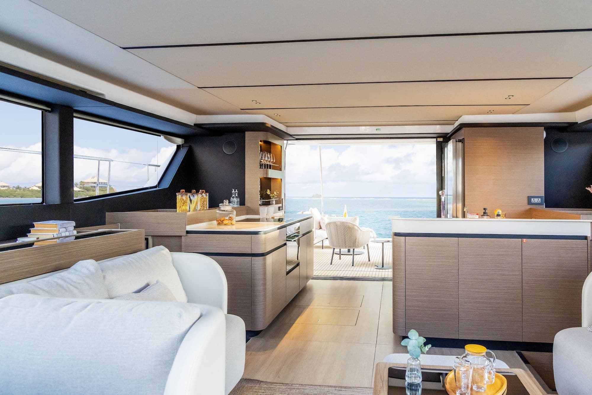 Salon and galley of the Leopard 53 Powercat opening to the aft cockpit