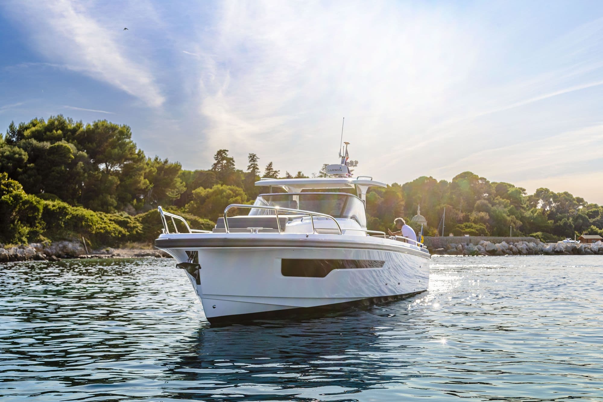Nimbus T11 at anchor in a wooded bay