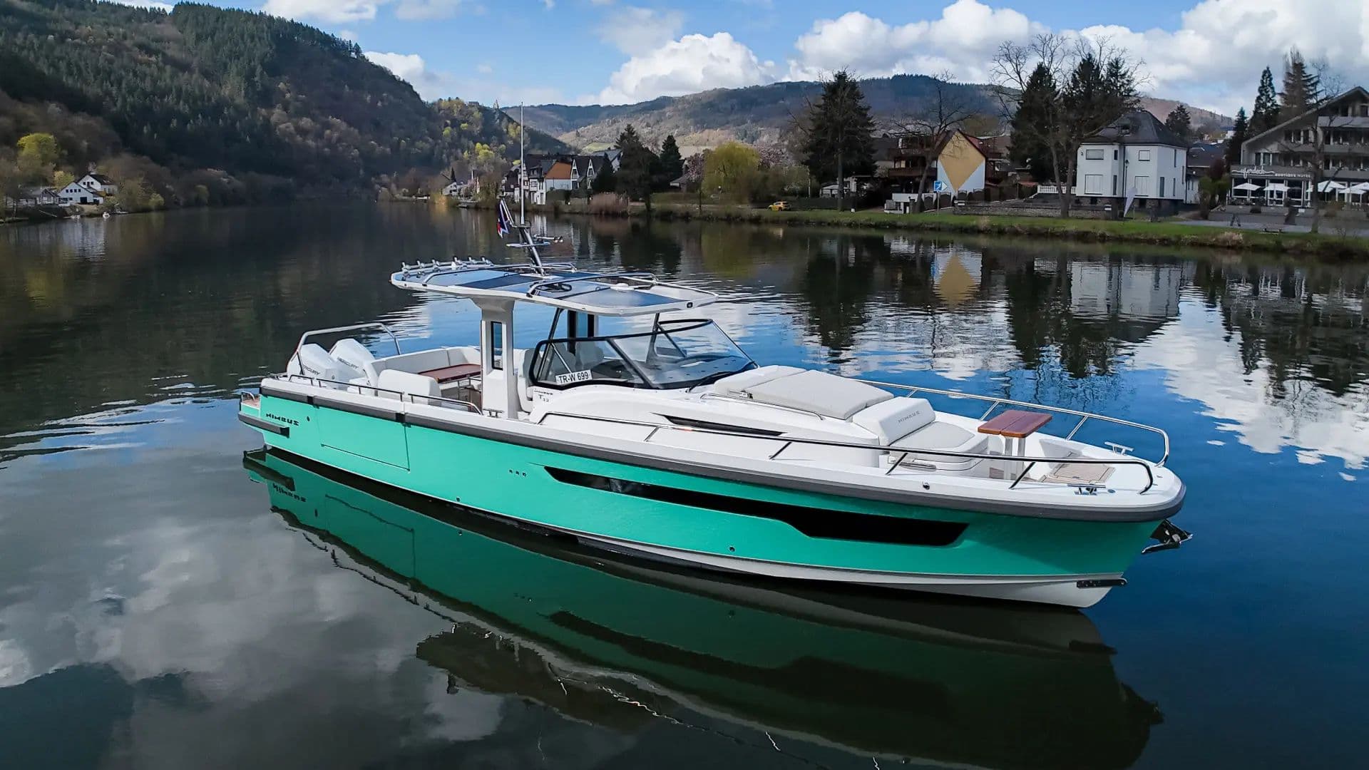 Nimbus T12 (Sport Tender 42) on a river with hills behind