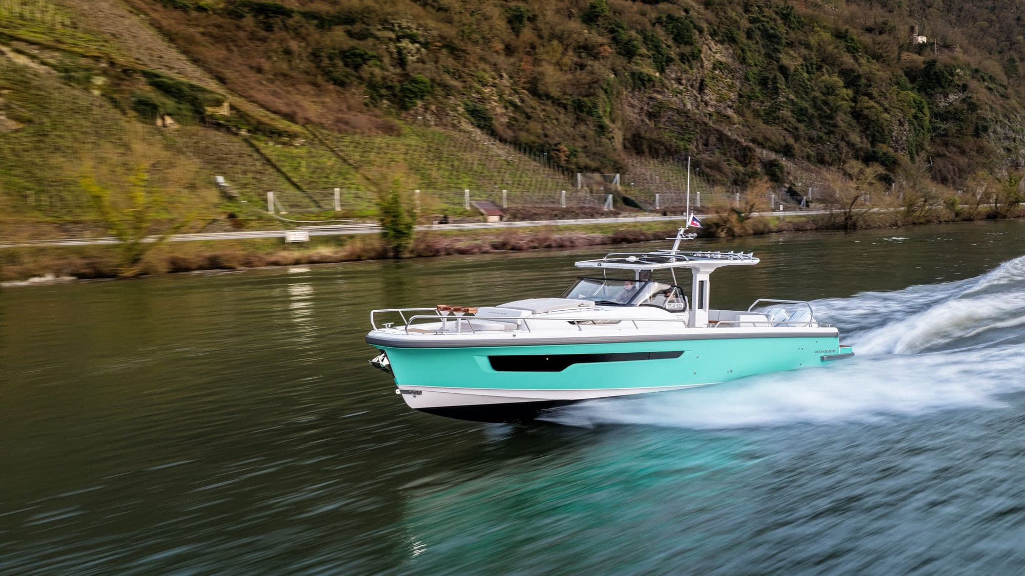 Nimbus T12 (Sport Tender 42) running on a calm river
