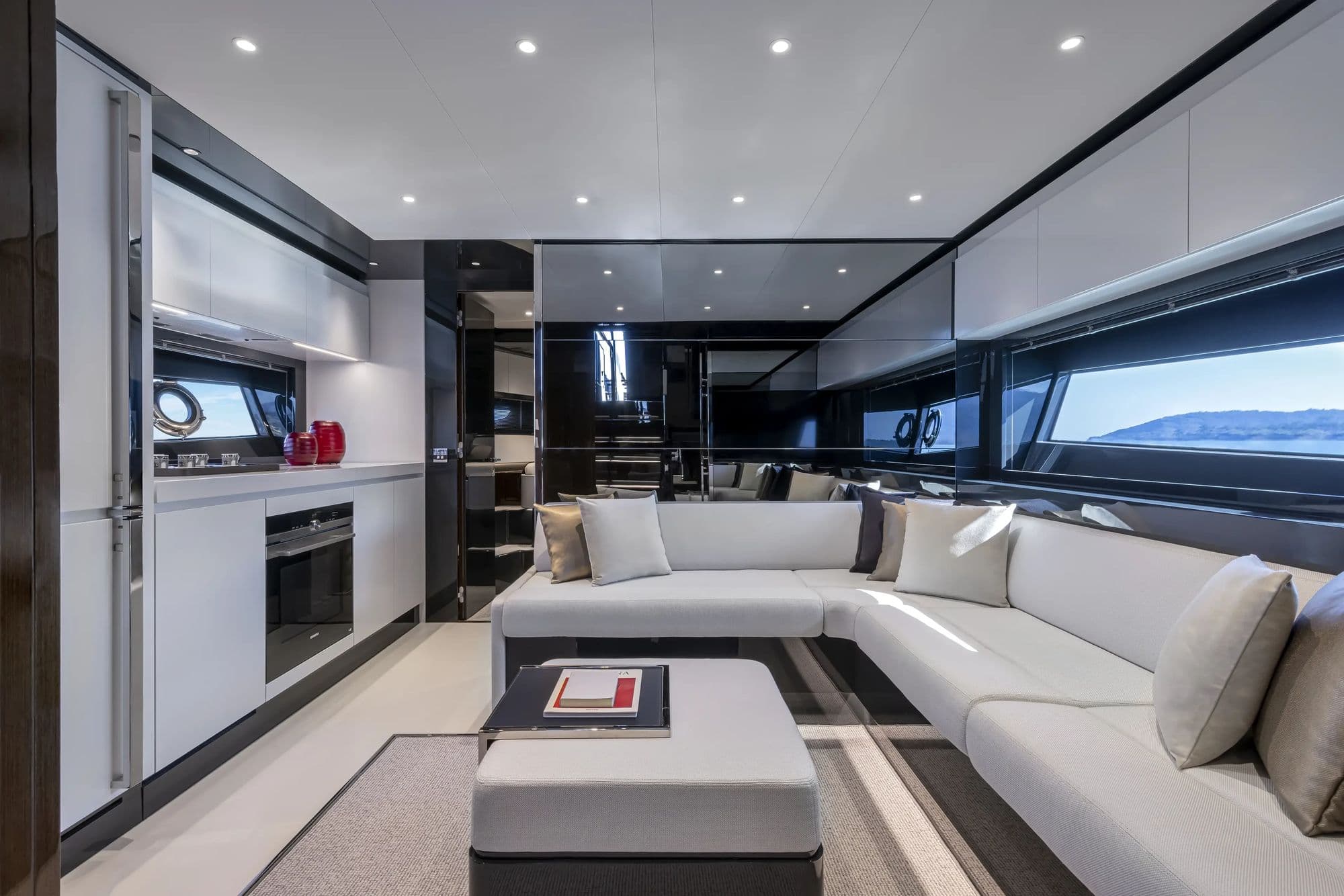 Lower-deck dinette and open galley aboard the Riva 68' Diable