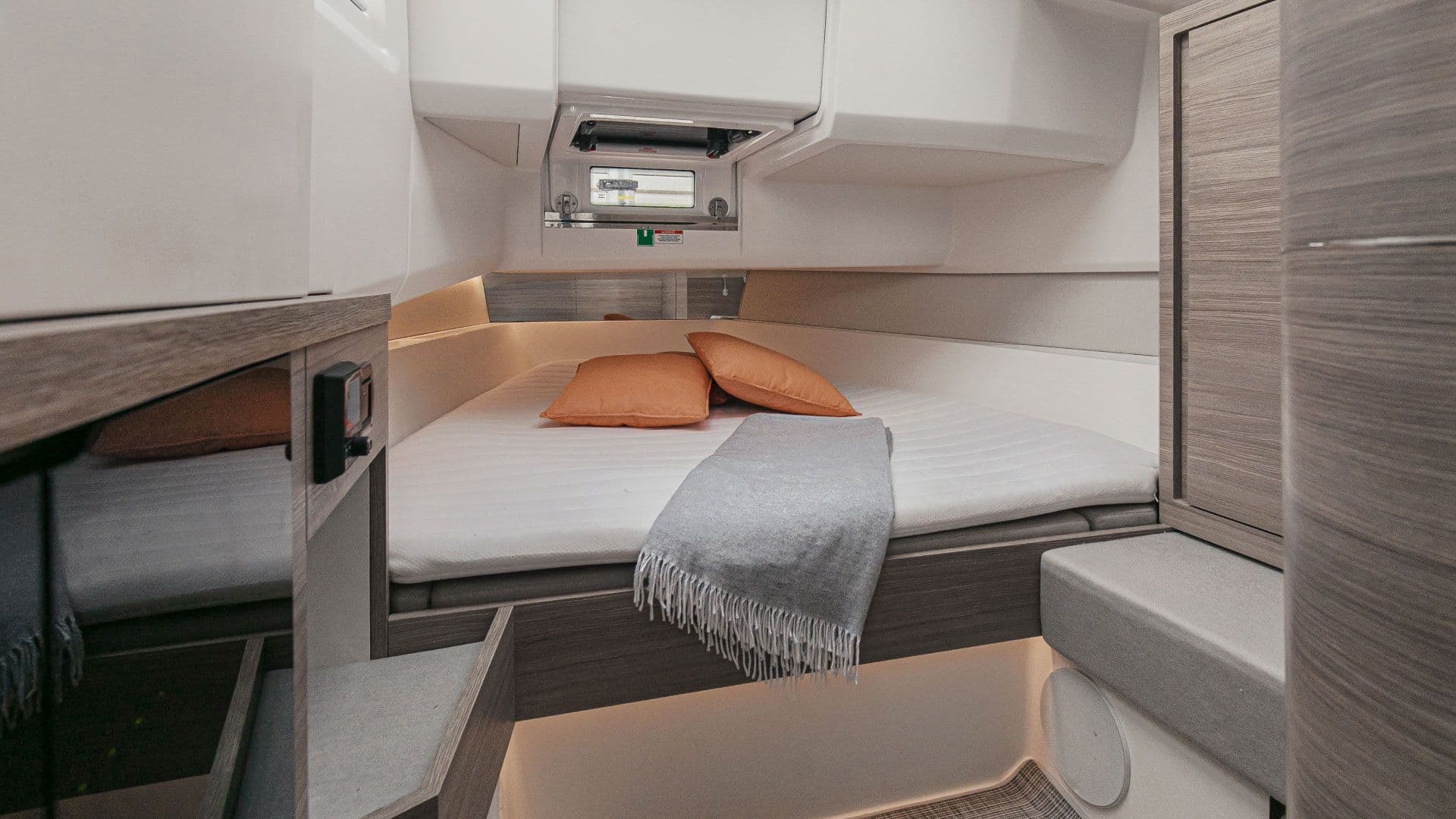 Cabin aboard the Saxdor 400 GTO with a double bed and ambient lighting