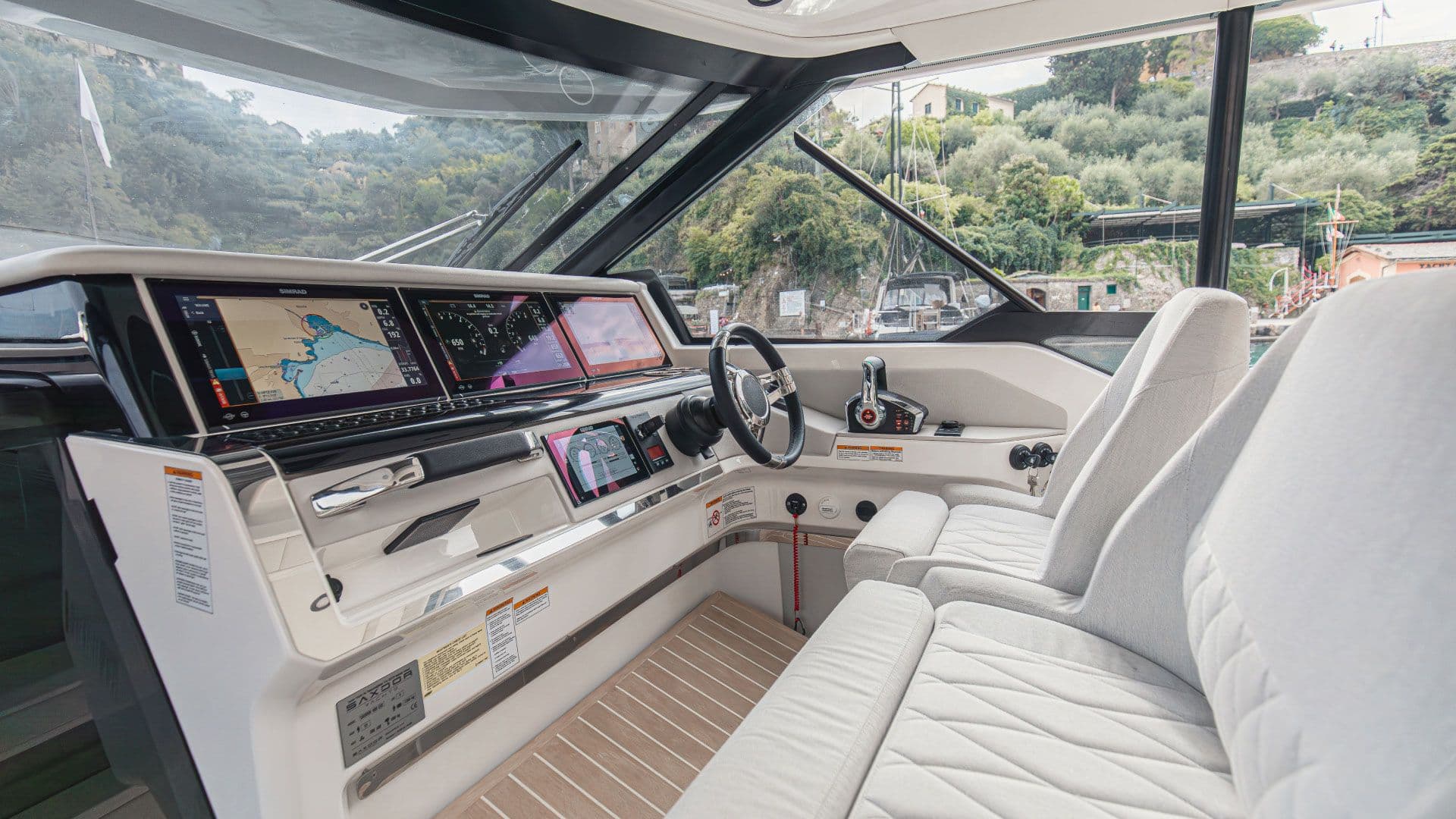 Helm of the Saxdor 400 GTO with twin screens under the wheelhouse roof
