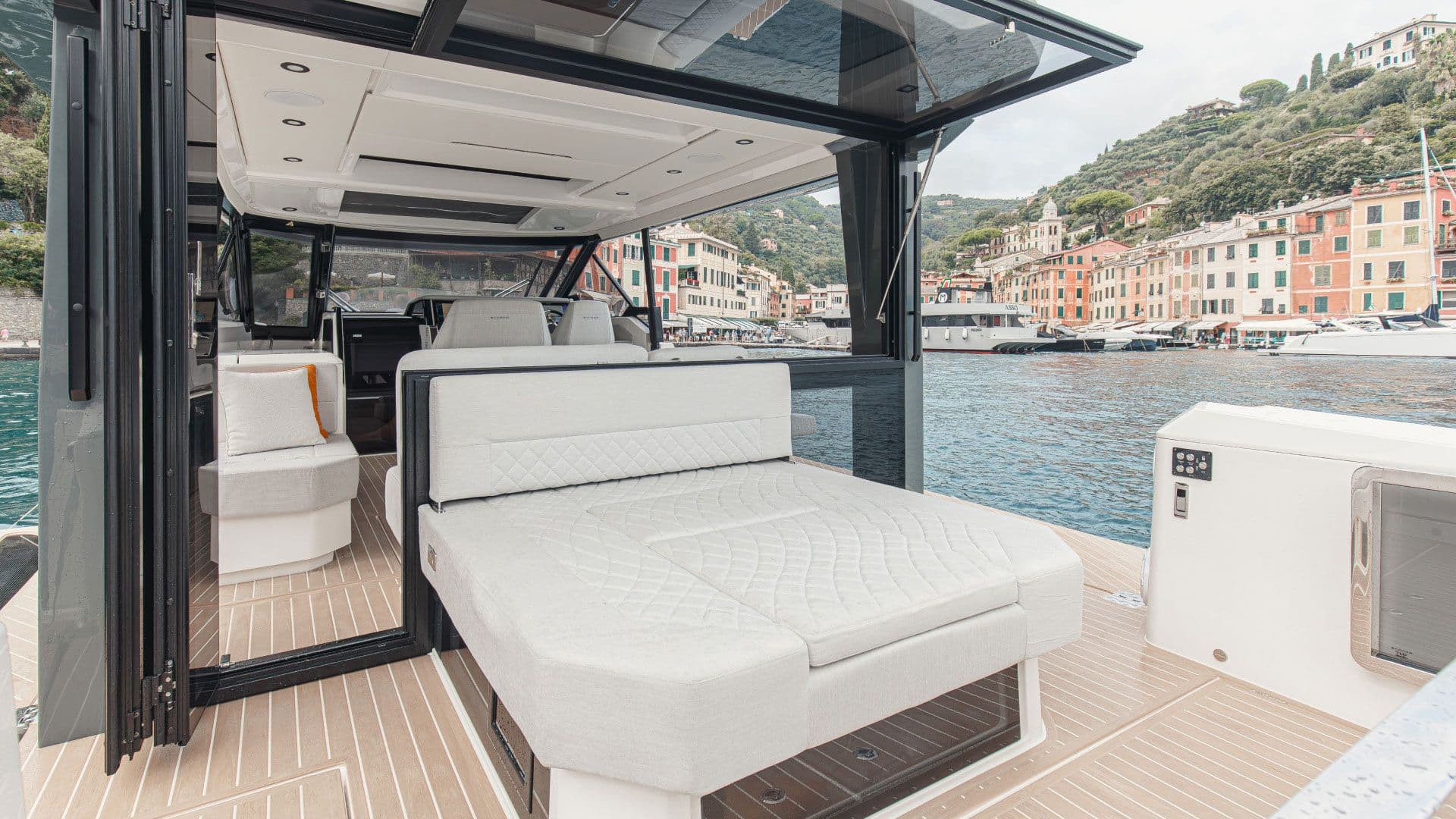 Rear sofa of the Saxdor 400 GTO pulled out into a sunbed behind the wheelhouse