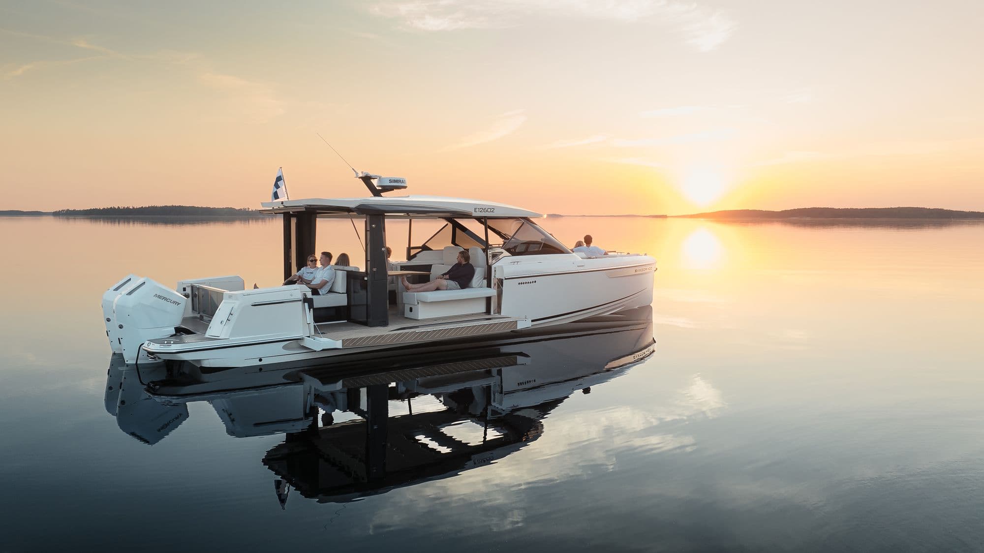 Saxdor 400 GTO at anchor on calm water at sunset