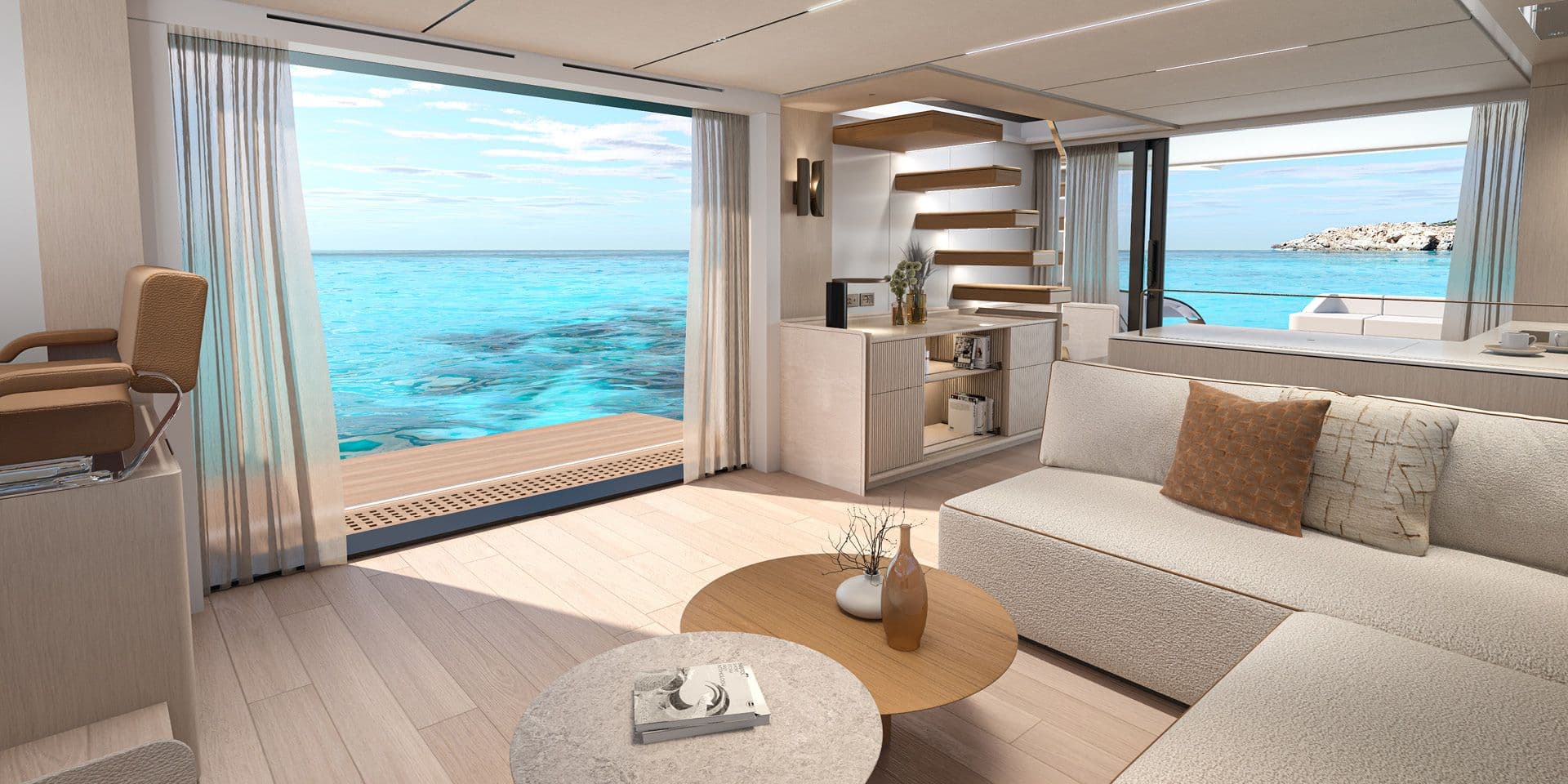 Saloon of the Solaris Power 70 Long Range with a wide sofa and the side windows open