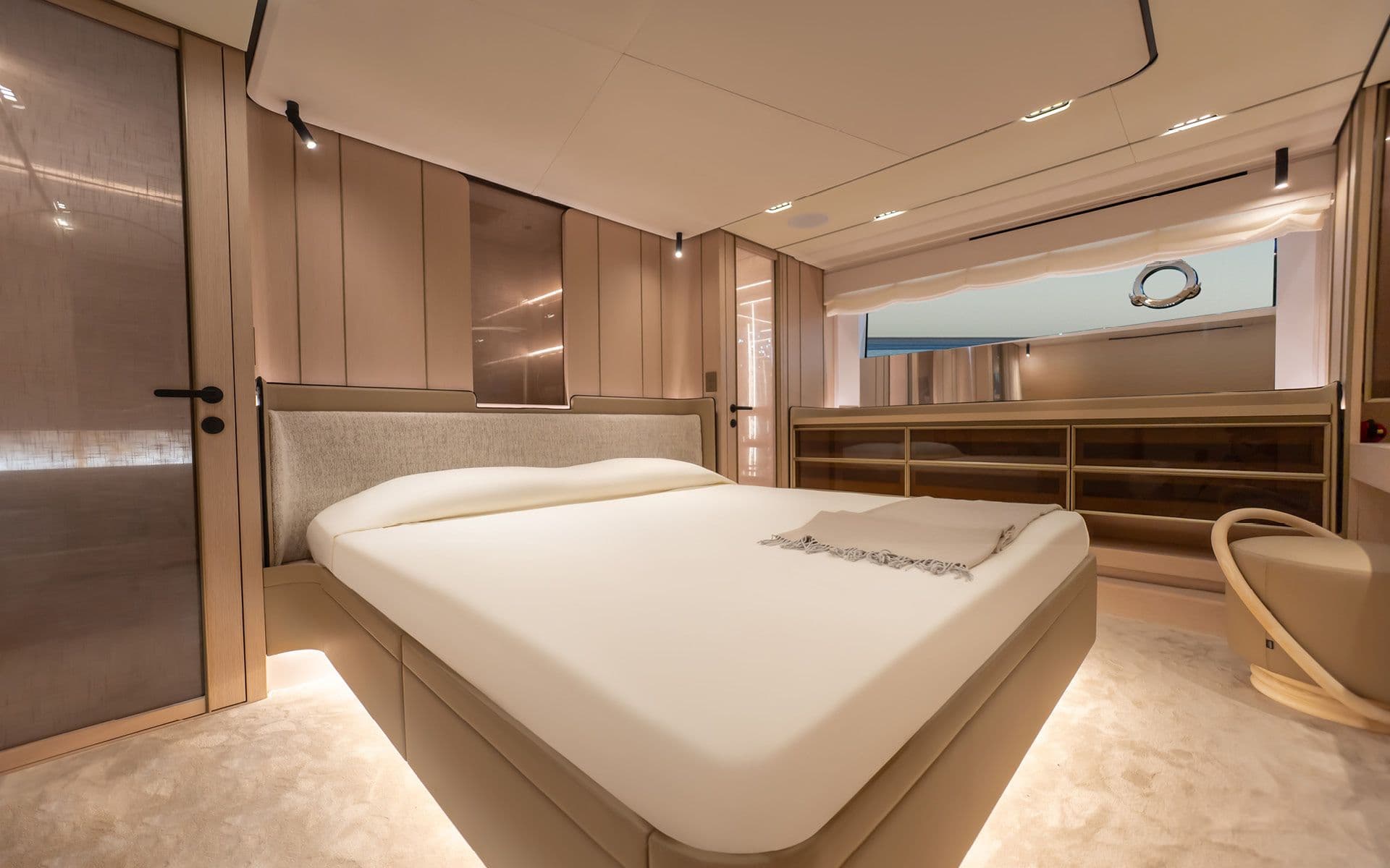 Guest cabin with a double bed aboard the Solaris Power 70 Long Range
