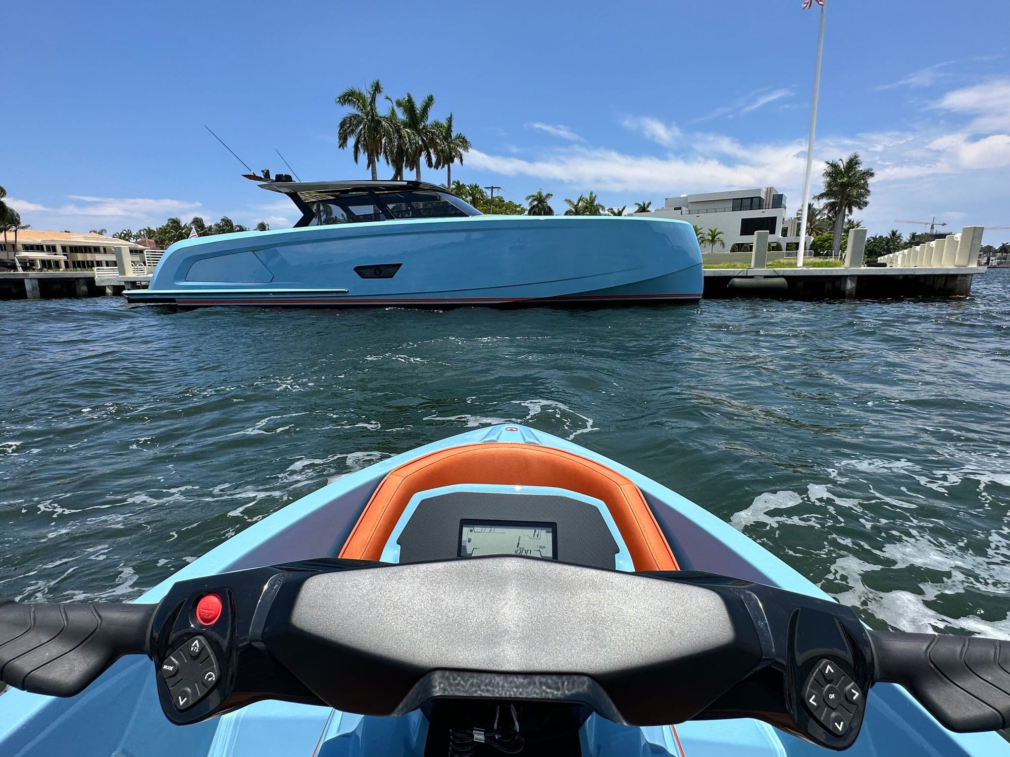 Vanquish VQ58 moored at a dock lined with palm trees