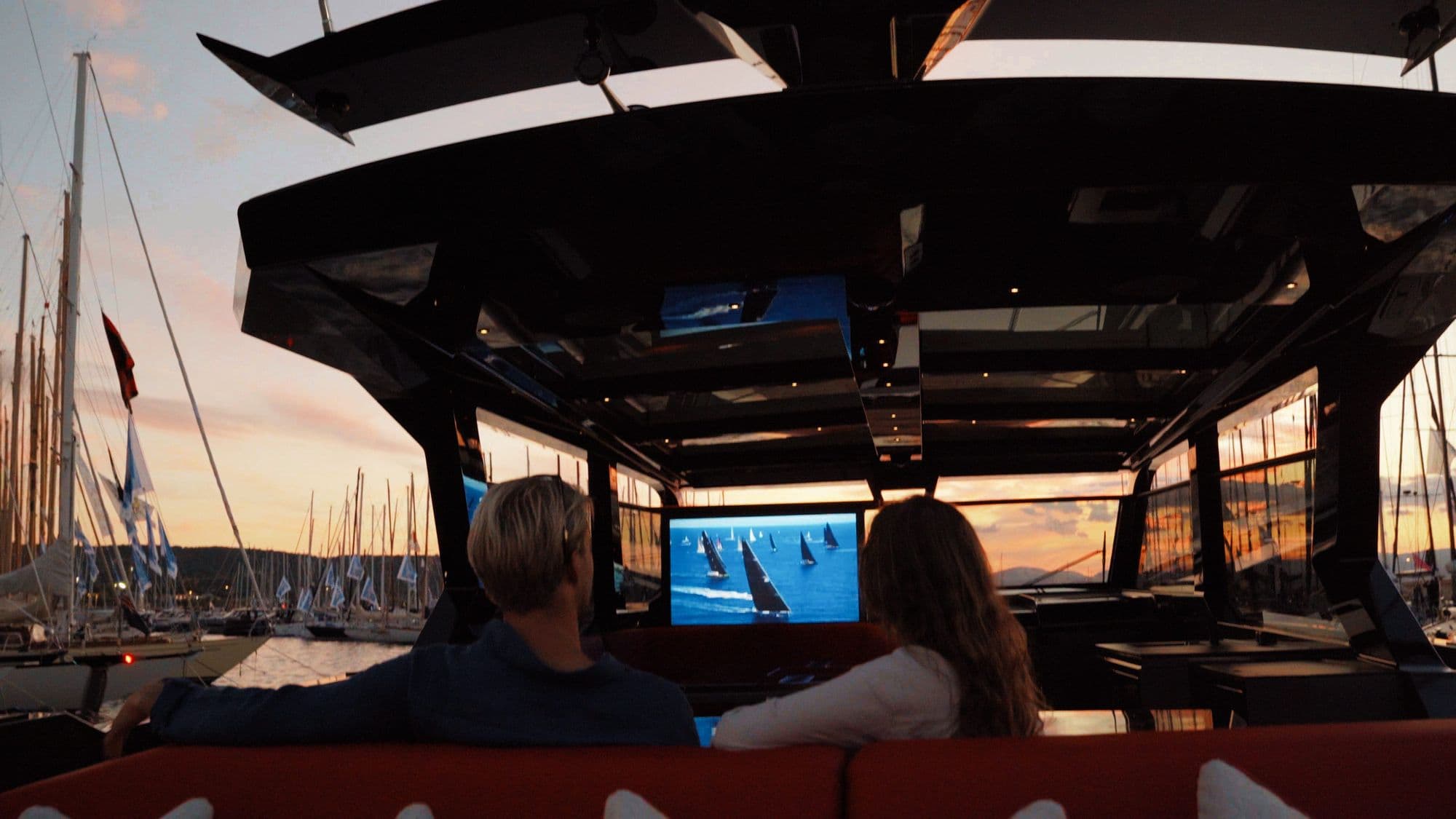 Guests watching the open-air cinema screen aboard the Vanquish VQ70