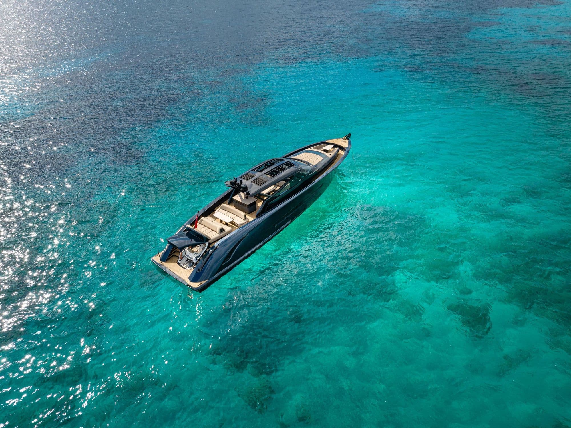 Wajer 77 at anchor in turquoise water seen from above