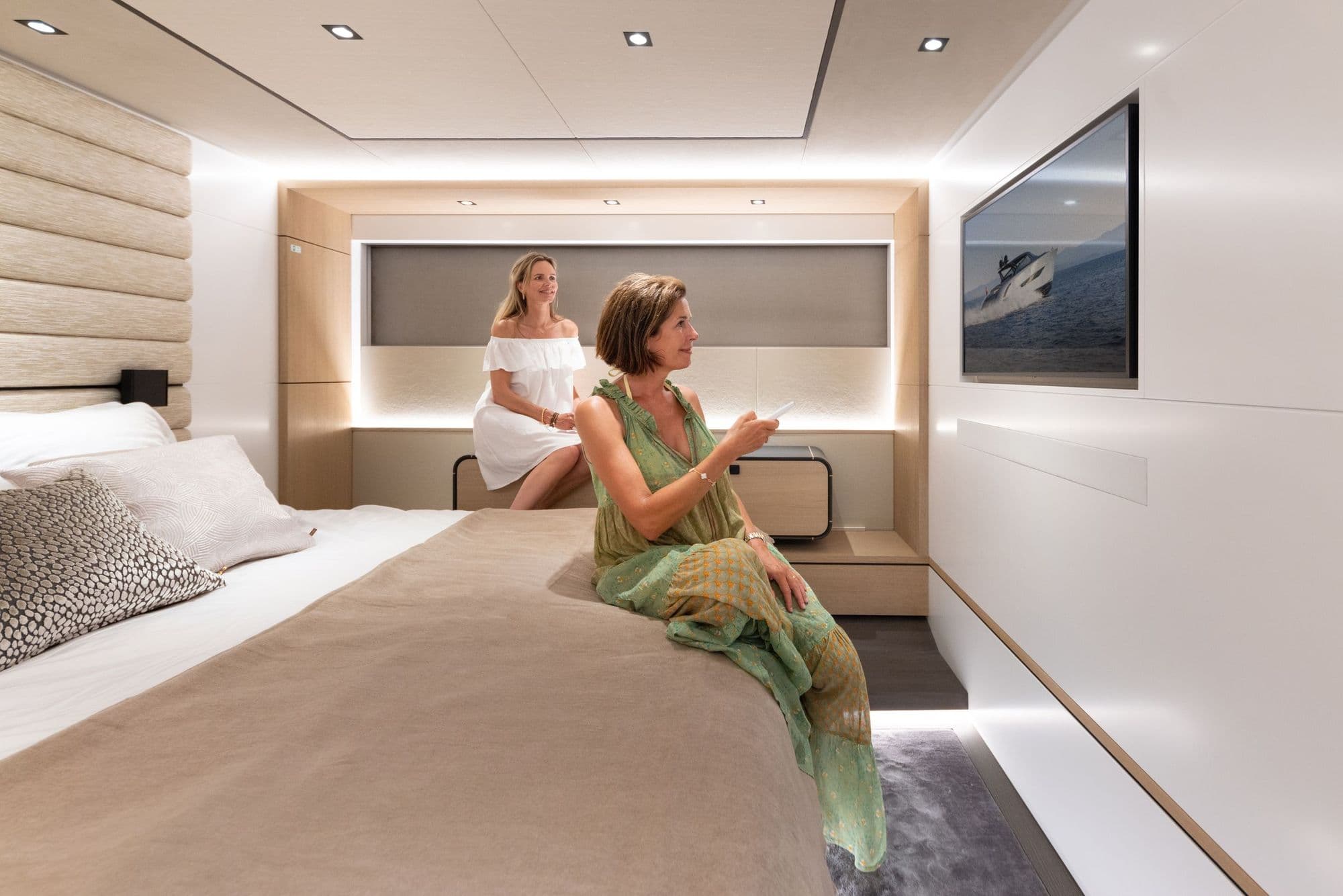 Master suite of the Wajer 77 with a king bed and a television