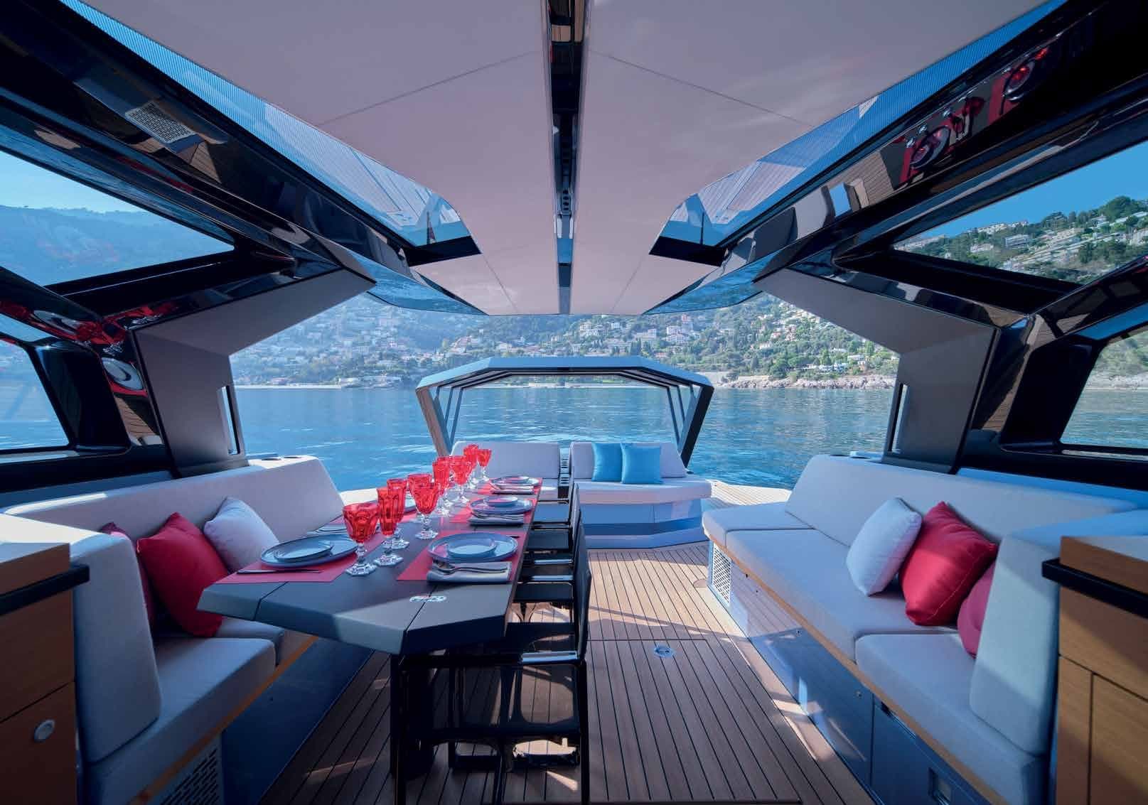 Cockpit of the Wally wallypower58 under its glass dome, with sofas and a dining table