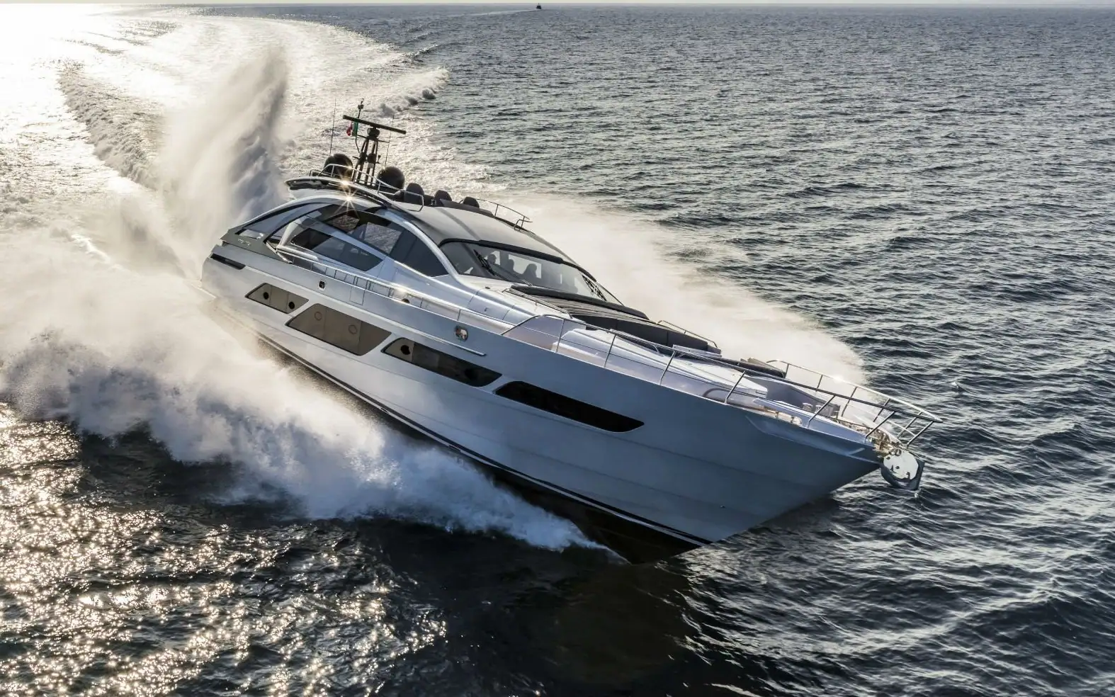 Pershing motor yacht running at speed, yachts for sale with RM Yachting